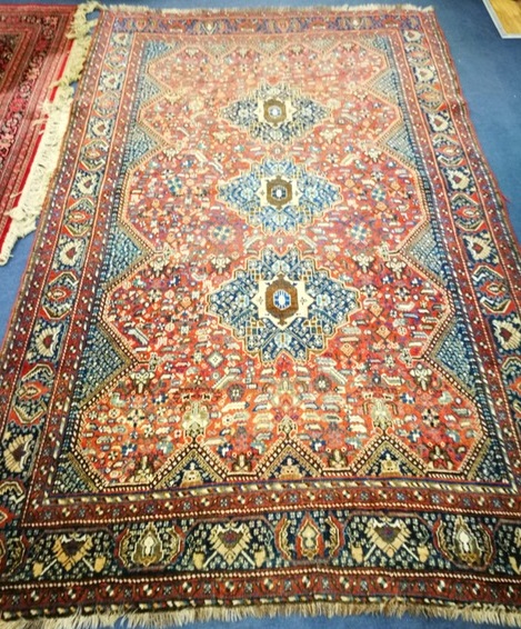 A Persian russet ground rug 270 x 164cm